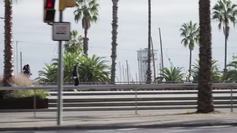 Barcelona-suburbs-and-bus-stop,-driving-side-window-view