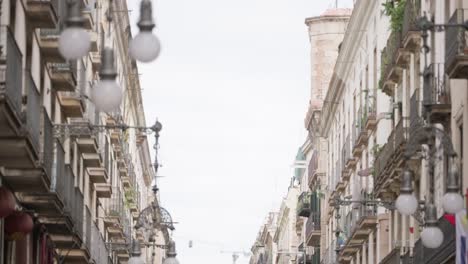 Straight-city-of-Barcelona-city-with-majestic-buildings,-tilt-down-view