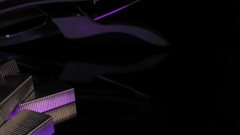 A-stylish-and-dignified-panning-close-up-of-blocks-of-staples-with-a-stapler-in-the-background-illuminated-by-a-purple-light-with-black-background