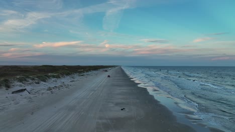 Ocean-Waves-And-Sandy-Shore-At-Padre-Island-In-Texas-At-Sunset---aerial-drone-shot