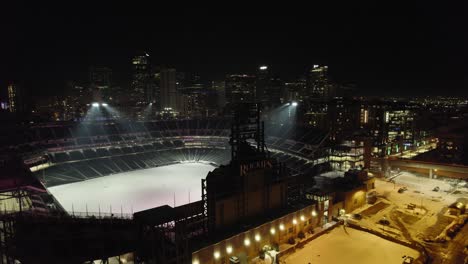 Rockies-Coors-Field-At-Night-With-Stadium-Flood-Lights-Turned-On-And-Snow-Covered-Field