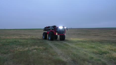 Orbiting-drone-shot-around-HORSCH-autonomous-tractor-on-open-farm-land