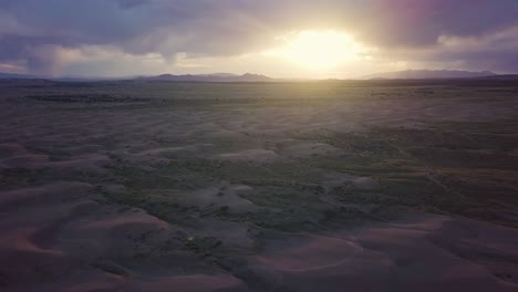 Slow,-smooth-flight-above-rugged-landscape-of-Mojave-Desert,-Utah-at-sunset