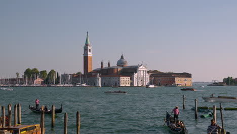 Traffic-Over-Grand-Canal-With-A-View-Of-San-Giorgio-Maggiore,-Islands-Of-Venice,-Northern-Italy