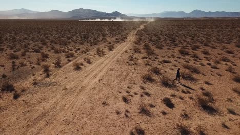 Woman-walks-across-Mojave-Desert,-Utah