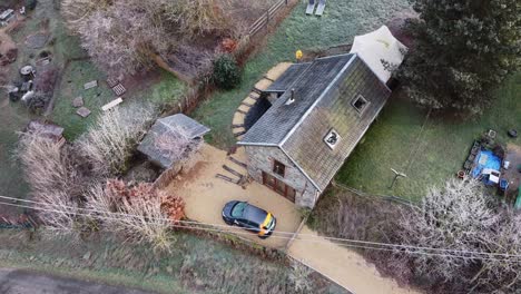 Aerial-view-of-a-Belgian-farm-house-in-stoutmont,-Wallonië,-Belgium