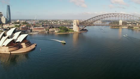 A-ferry-rounding-the-Sydney-Opera-House-with-the-Sydney-Harbour-Bridge-in-the-background