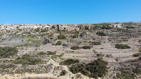 Xaghra,-Gozo-Ramla-bay-panorama-view-from-sea-toward-Calypso-Cave,-Malta-islands-aerial-landscape-view-on-hot-summer-day