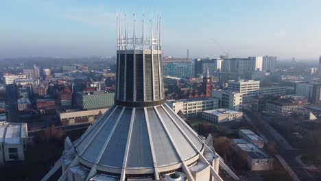 Liverpool-Metropolitan-cathedral-contemporary-city-landmark-rooftop-spires-aerial-rising-pull-back