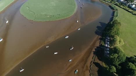 Aerial-shot-of-sailboats-at-the-mouth-of-Exe-River,-Exeter,-UK