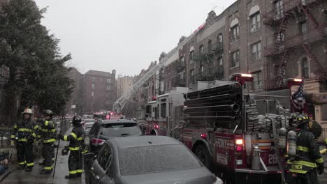 Fire-department-in-a-Brooklyn-street-accessing-a-fire-caused-by-a-short-circuit-in-ConEd-power-cable---Wide-shot