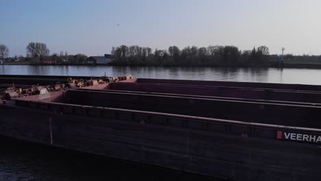 Empty-Cargo-Barge-In-Pushtow-At-Oude-Maas-River-In-South-Holland,-Netherlands