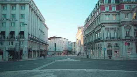 Empty-Lisbon-city-downtown-close-to-tube-entrance,-old-buildings-facade,-closed-stores,-during-covid-19-lockdown-4k