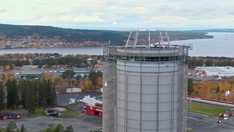 Restaurant-Arctura-near-tower-in-aerial-orbiting-view,-city-of-Ostersund