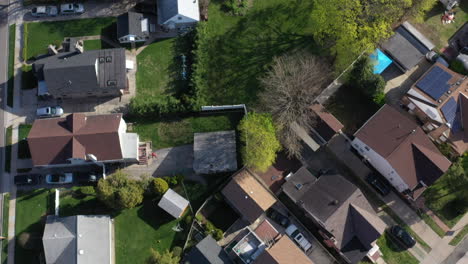 A-top-down-shot-taken-directly-over-a-quiet-suburban-neighborhood-on-a-sunny-day