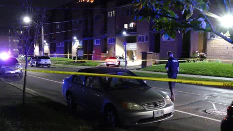 Policeman-searching-evidence-on-street-private-crime-scene-area