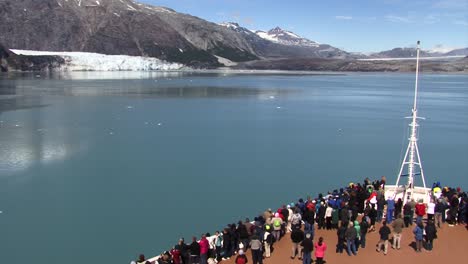 Tourists-enjoy-the-scenery-on-the-bow-of-the-ship