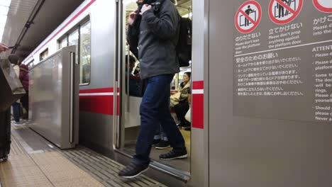 Tokyo,Japan:-POV-to-the-subway-train-commuter-in-tokyo,-Japan-while-train-door-is-opening-and-passenger-get-out-from-the-train-in60FPS-4K-video