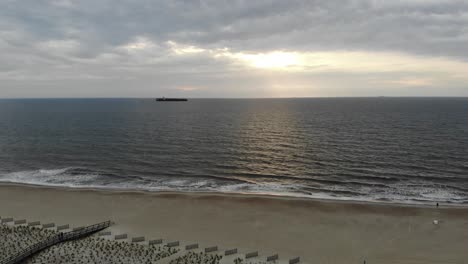 cargo-container-ship-leaving-port-of-savannah-sunrise-atlantic-ocean-tybee-island-aerial-drone-tracking