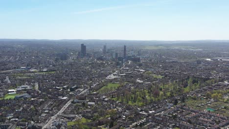 dolly-back-drone-shot-over-gentrified-suburban-london-looking-towards-central-croydon