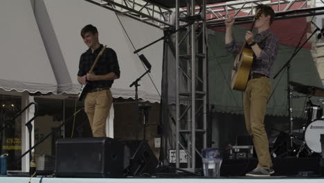 Singer-and-guitarist,-concert-at-Dogwood-Festival,-Siloam-Springs,-AR,-wide-shot