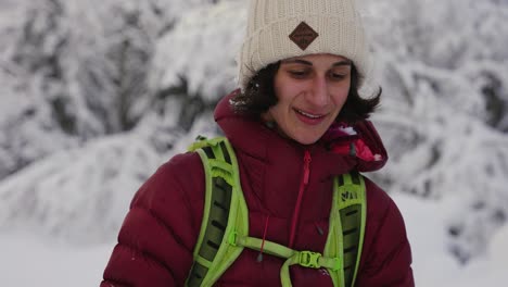 Slow-motion-of-happy-skier-woman-looking-into-camera-with-cold-nose