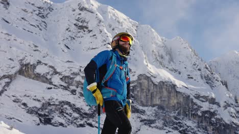 Man-standing-in-skiing-gear-admiring-the-breathtaking-view