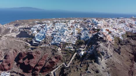 Aerial-View-Towardsr-Oia,-Town-On-The-Island-Santorini,-Greece
