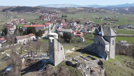 Wide-areal-footage-of-ruins-on-top-of-the-hill,-castle-Sokolovac-in-Brinje,-Croatia