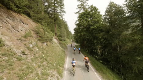 Cyclists-Racing-On-Mountain-Pass-During-Raid-Evolenard-2021-Mountain-Bike-Race-In-Val-d'Herens,-Valais,-Switzerland