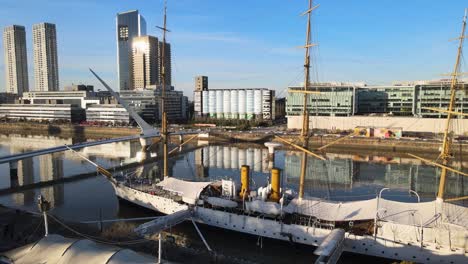 Aerial-of-large-wooden-sailboat-by-Puente-de-la-Mujer-in-Buenos-Aires