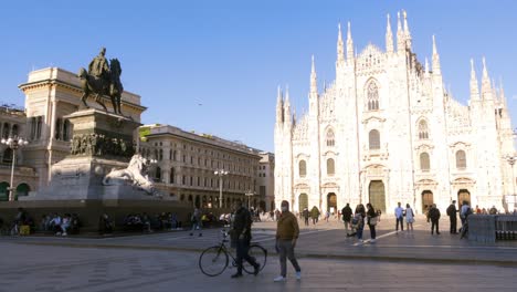 Milan,-Italy---May-03,-2021:-Crowd-of-tourists-in-the-square-in-front-of-the-Duomo-of-Milan,-Italy,-many-people-with-masks-to-protect-themselves-from-Covid-19-infection,-pandemic,-virus