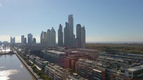 Aerial-view-of-Puerto-Madero-district-at-daytime-with-skyscrapers-at-back