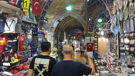 Tilt-down-from-Turkish-flag-to-interior-street-of-the-Grand-Bazaar-in-Istanbul