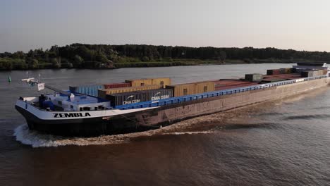 Aerial-Port-And-Forward-Bow-View-Of-Cargo-Ship-Zembla-Going-Past-On-Oude-Maas-Near-Barendrecht