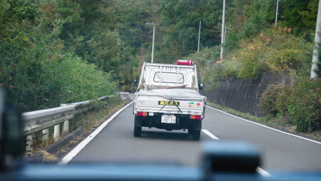 Driving-And-Following-A-Truck-On-Asphalt-Road-In-Slow-Motion