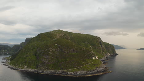 Aerial-View-Of-Hendanes-Lighthouse-On-The-Elevated-Shore-Of-The-Island-Of-Vagsoy-In-Norway