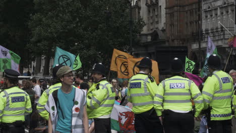 London-Metropolitan-Police-Officers-Stand-Beside-Protestors-At-Whitehall-In-London,-Locked-Off