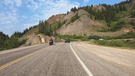 POV-while-driving-on-Million-Dollar-Highway-approaching-and-driving-through-one-of-the-many-hairpin-curves-near-Red-Mountain-Pass