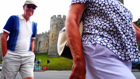 Conwy-castle-busy-traffic-landmark-North-Wales-roundabout-with-tourists-passing