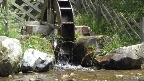 View-Of-A-Spinning-Water-Wheel-On-A-River-In-Austria---close-up