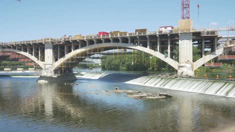 third-ave-bridge-construction-arch-support-scaffolding-workers-river-water-slow-motion