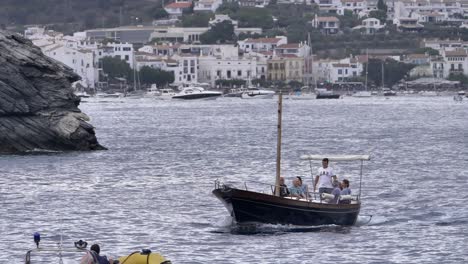Family-Ride-On-Mediterranean-Boat-Sailing-In-The-Ocean-Near-Cadaques-Town-In-Spain