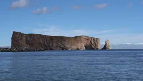 A-beautiful-perspective-of-the-Perce-Rock-at-Gaspe-with-a-quiet-sea