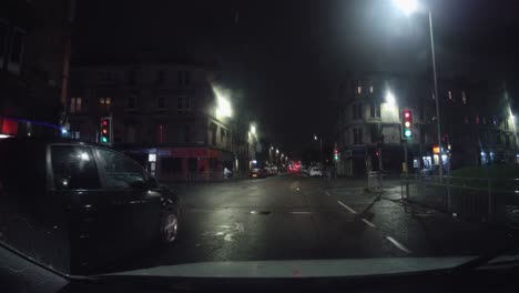 Three-cyclists-turn-onto-the-road-at-night