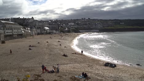 Porthmeor-Beach-on-a-sunny-afternoon-in-St-Ives,-Cornwall,-UK