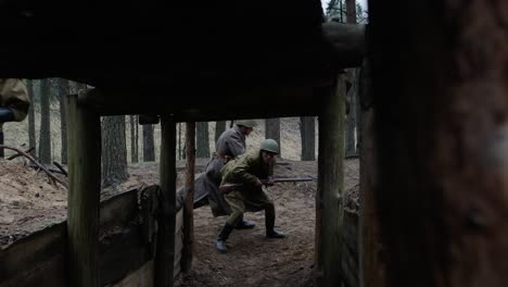 Soldier-running-to-save-a-soldier-from-enemy-in-a-war-shelter