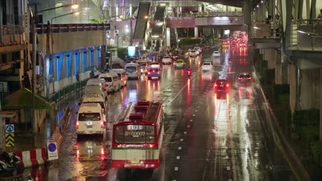 Cars-crowded-at-night-in-front-of-Central-Ladprao-Department-Store,-Bangkok