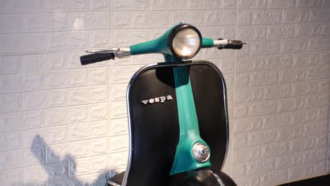 Classic-Vespa-With-Green-Handle-Bar-And-Black-Leg-Shield-Indoors