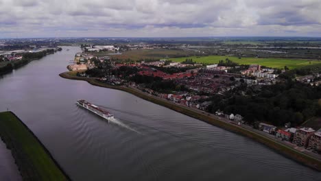 High-Aerial-View-Of-Viking-Ve-Cruise-Longship-Navigating-Along-River-Noord-Near-Hendrik-Ido-Ambacht